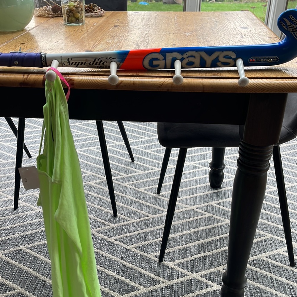Super fun, athletic wear hooks with a field hockey stick